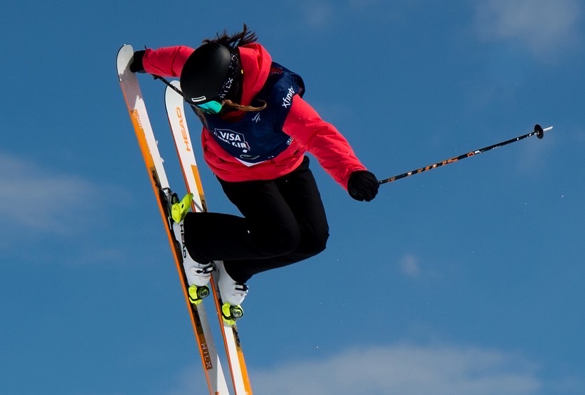 Izzy Atkin during a ski jump.  Photo credit: FIS Images.