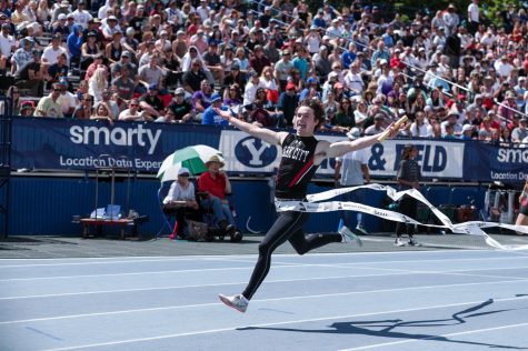 Carson Baynes crossing the finish line first in the 4x100m event at Brigham Young University. Courtesy of Shannon Baynes.